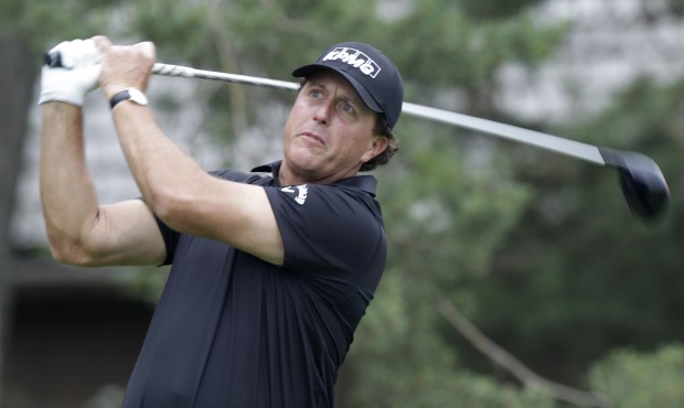 Phil Mickelson tees off on the second tee during the third round of the Memorial golf tournament Sa...