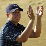 
              FILE - In this June 21, 2015, file photo, Jordan Spieth claps after finishing the final round of the U.S. Open golf tournament at Chambers Bay in University Place, Wash. Spieth isn't taking the traditional route to the British Open. Rather than prep for St. Andrews in Scotland this weekend, Speith will spend it in the Quad Cities playing the John Deere Classic _ site of his first win as a pro two years ago.   (AP Photo/Ted S. Warren, File)
            