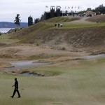 
              Tiger Woods walks off the 17th green during the first round of the U.S. Open golf tournament at Chambers Bay on Thursday, June 18, 2015 in University Place, Wash. (AP Photo/Ted S. Warren)
            