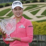 
              Minjee Lee, of Australia, holds the winners trophy after winning the rain delayed Kingsmill Championship  LPGA golf tournament at the Kingsmill Golf Club in Williamsburg, Va., Monday, May 18, 2015.    (AP Photo/Steve Helber)
            