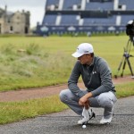 
              United States’ Jordan Spieth looks at his ball on a path behind the 17th green during a practice round at the British Open Golf Championship at the Old Course, St. Andrews, Scotland, Wednesday, July 15, 2015. (AP Photo/Peter Morrison)
            