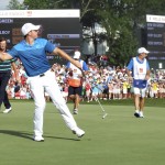 
              Rory McIlroy, of Northern Ireland, prepares to throw his ball into the crowd as he celebrates after winning the Wells Fargo Championship golf tournament at Quail Hollow Club in Charlotte, N.C., Sunday, May 17, 2015. (AP Photo/Barb Leverone)
            
