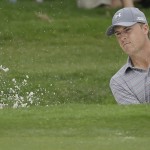 
              Jordan Spieth hits from a bunker on the 12th hole during the third round of the Colonial golf tournament Saturday, May 23, 2015, in Fort Worth, Texas. (AP Photo/LM Otero)
            