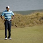 
              Tiger Woods stands on the 18th green during a practice round for the U.S. Open golf tournament at Chambers Bay on Monday, June 15, 2015, in University Place, Wash. (AP Photo/Ted S. Warren)
            