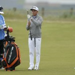 
              United States’ Rickie Fowler inspects a club before taking a shot on the seventh hole during a practice round at the British Open Golf Championship at the Old Course, St. Andrews, Scotland, Tuesday, July 14, 2015. (AP Photo/Peter Morrison)
            