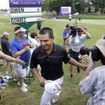 
              Fabian Gomez, center, of Argentina, is congratulated as he leaves the 18th green to sign his scorecard after winning the St. Jude Classic golf tournament Sunday, June 14, 2015, in Memphis, Tenn. (AP Photo/Mark Humphrey)
            