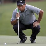 
              K.J. Choi lines up a putt on the first hole during the first round of the Wells Fargo Championship golf tournament at Quail Hollow Club in Charlotte, N.C., Thursday, May 14, 2015. (AP Photo/Chuck Burton)
            