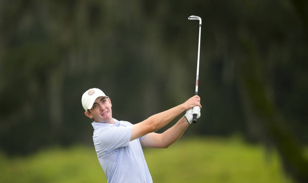 In a photo provided by the USGA, Philip Barbaree watches his second shot on the ninth hole during m...