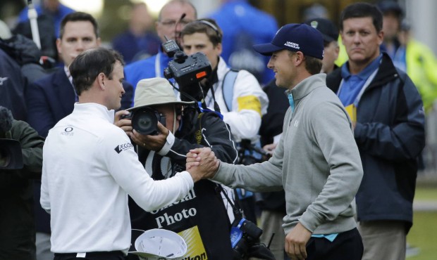 United States’ Zach Johnson, left, is congratulated by United States’ Jordan Spieth aft...