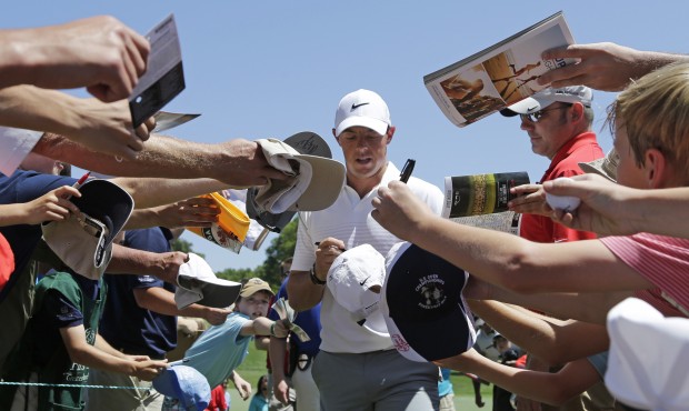 Rory McIlroy signs autographs as he walks to the third tee during the pro-am for the Wells Fargo Ch...