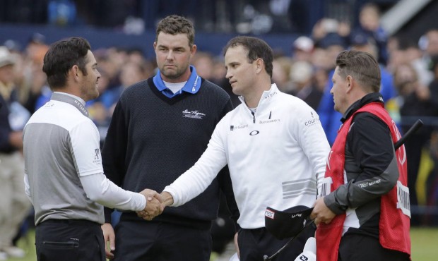 United States’ Zach Johnson, second from right, shakes hands with South Africa’ Louis O...