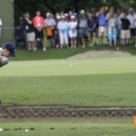 
              Jordan Spieth hits a tee shot on the shortened 14th hole during the second round of the Byron Nelson golf tournament, Friday, May 29, 2015, in Irving, Texas. The 14th fairway was washed over by a flash flood so the the hole was shortened to a 100-yard par 3. (AP Photo/LM Otero)
            