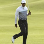 
              United States’ Tiger Woods reacts as he putts to the 18th green during the second round of the British Open Golf Championship at the Old Course, St. Andrews, Scotland, Saturday, July 18, 2015. Woods failed to make the cut. (AP Photo/David J. Phillip)
            