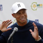 Tiger Woods talks to the media after playing a practice round at the Phoenix Open golf tournament on Tuesday, Jan. 27, 2015, in Scottsdale, Ariz. (AP Photo/Rick Scuteri) 
