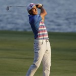 
              Rickie Fowler hits on the 18th hole fairway during the playoff round of The Players Championship golf tournament Sunday, May 10, 2015, in Ponte Vedra Beach, Fla. (AP Photo/John Raoux)
            
