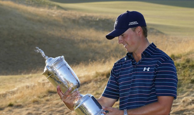 Jordan Spieth looks at the trophy after winning the final round of the U.S. Open golf tournament at...