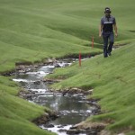 
              Martin Flores walks to his ball by the creek on the 18th hole during the second round of the Wells Fargo Championship golf tournament at Quail Hollow Club in Charlotte, N.C., Friday, May 15, 2015. (AP Photo/Chuck Burton)
            