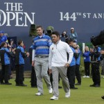 
              Australia’s Marc Leishman, center left, and South Africa’ Louis Oosthuizen walk off the green after the final round at the British Open Golf Championship at the Old Course, St. Andrews, Scotland, Monday, July 20, 2015. (AP Photo/David J. Phillip)
            