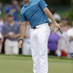
              Rory McIlroy, of Northern Ireland, reacts after missing a birdie putt on the fourth hole during the final round of the Wells Fargo Championship golf tournament at Quail Hollow Club in Charlotte, N.C., Sunday, May 17, 2015. (AP Photo/Bob Leverone)
            