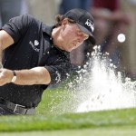 
              Phil Mickelson hits from a sand trap to the fifth green during the second round of the Wells Fargo Championship golf tournament at Quail Hollow Club in Charlotte, N.C., Friday, May 15, 2015. (AP Photo/Bob Leverone)
            