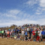
              Fans watch as Tiger Woods plays the ninth hole during the first round of the U.S. Open golf tournament at Chambers Bay on Thursday, June 18, 2015 in University Place, Wash. (AP Photo/Matt York)
            