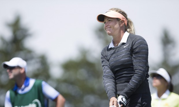 Suzann Pettersen, of Norway, watches her shot off the first tee to begin her final round of the 201...
