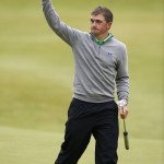 
              Ireland’s Paul Dunne waves to the crowd on the 18th hole during the final round at the British Open Golf Championship at the Old Course, St. Andrews, Scotland, Monday, July 20, 2015. (AP Photo/Jon Super)
            