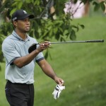 
              Tiger Woods points in the direction of his drive on the 11th hole during the second round of the Memorial golf tournament Friday, June 5, 2015, in Dublin, Ohio. (AP Photo/Darron Cummings)
            