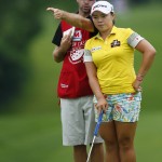 
              Ha Na Jang of South Korea talks to her caddie David Stone on the 18th green during the second round of the Marathon Classic golf tournament at Highland Meadows Golf Club in Sylvania, Ohio, Friday, July 17, 2015. (AP Photo/Rick Osentoski)
            