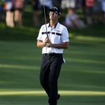 
              Danny Lee, from New Zealand, reacts after missing a birdie putt on the 18th green during the third round of the John Deere Classic golf tournament Saturday, July 11, 2015, in Silvis, Ill. (AP Photo/Charles Rex Arbogast)
            