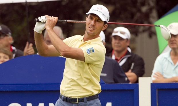 n FILE – In this July 23, 2014, file photo, Canada’s Mike Weir tees off during the pro-...