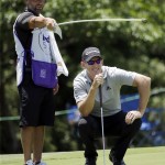 
              Greg Owen, right, of England, reads the eighth green with his caddie during the first round of the St. Jude Classic golf tournament Thursday, June 11, 2015, in Memphis, Tenn. Owen parred the hole. (AP Photo/Mark Humphrey)
            