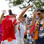 
              Chella Choi, front left, of South Korea, and her father and caddie Ji Yeon Choi, right, are doused by Mi Hyang Lee, also of South Korea, after winning the Marathon Classic golf tournament on the first playoff hole at Highland Meadows Golf Club in Sylvania, Ohio, Sunday, July 19, 2015. (AP Photo/Rick Osentoski)
            