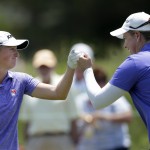 
              Stacy Lewis, left, celebrates an eagle as she fist bumps with Brittany Lincicome on the ninth hole during the first round of the ShopRite LPGA Classic golf tournament, Friday, May 29, 2015, in Galloway Township, N.J. (AP Photo/Mel Evans)
            