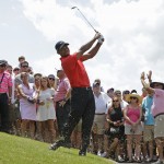 
              Tiger Woods hits from the rough off the 18th fairway during the final round of The Players Championship golf tournament, Sunday, May 10, 2015, in Ponte Vedra Beach, Fla. (AP Photo/Lynne Sladky)
            