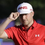 
              Austin Cook tips his cap to the crowd after sinking a birdie putt on the ninth green to give him an 8-under-par 132, as he finished the second round of the St. Jude Classic golf tournament Friday, June 12, 2015, in Memphis, Tenn. (AP Photo/Mark Humphrey)
            