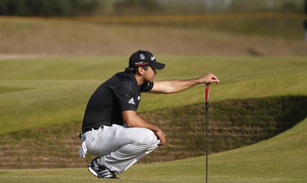 Australia’s Jason Day lines up a putt on the 15th hole during the third round at the British ...