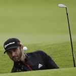 
              United States’ Dustin Johnson plays out of a bunker on the 17th hole during the third round at the British Open Golf Championship at the Old Course, St. Andrews, Scotland, Sunday, July 19, 2015. (AP Photo/David J. Phillip)
            
