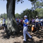 
              Rickie Fowler follows his shot from behind a tree off the third hole during the first round of The Players Championship golf tournament Thursday, May 7, 2015 in Ponte Vedra Beach, Fla. (AP Photo/Chris O'Meara)
            