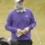 
              Austria's Bernd Wiesberger feels the cold during round three of the Irish Open Golf Championship at Royal County Down, Newcastle, Northern Ireland, Saturday, May 30, 2015.  (AP Photo/Peter Morrison)
            