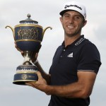 
              FILE - In this March 8, 2015, file photo, Dustin Johnson holds the Gene Sarazen Cup after winning the Cadillac Championship golf tournament in Doral, Fla. (AP Photo/Wilfredo Lee, File)
            