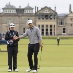 
              With the clubhouse in the background Jordan Spieth of the United States reacts after playing a shot on the first green during a practice round at St Andrews Golf Club prior to the start of the British Open Golf Championship, in St. Andrews, Scotland, Monday, July 13, 2015. (AP Photo/Jon Super)
            