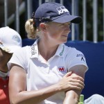 
              Defending champion Stacy Lewis applies lotion to her arms before playing in the final round of the NW Arkansas Championship LPGA golf tournament at Pinnacle Country Club in Rogers, Ark., Sunday, June 28, 2015. (AP Photo/Danny Johnston)
            