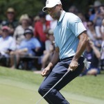 
              Tiger Woods reacts to a missed putt on the eighth hole during the second round of The Players Championship golf tournament Friday, May 8, 2015, in Ponte Vedra Beach, Fla. (AP Photo/Lynne Sladky)
            