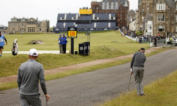 Bill Haas from the U.S. plays from the path on the 17th hole during a practice round at St. Andrews...