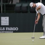 
              Adam Scott, of Australia, putts on the 10th hole during the second round of the Wells Fargo Championship golf tournament at Quail Hollow Club in Charlotte, N.C., Friday, May 15, 2015. (AP Photo/Chuck Burton)
            