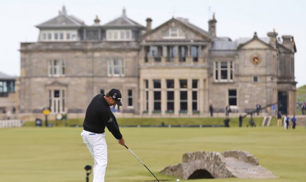 Ireland’s Padraig Harrington plays from the 18th tee during the third round of the British Op...