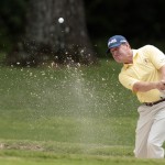 
              Jeff Maggert hits out of the bunker on the sixth hole during the Regions Tradition Champions Tour golf tournament at Shoal Creek Country Club, Saturday, May 16, 2015, in Birmingham, Ala. (AP Photo/Butch Dill)
            