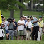 
              Tiger Woods hits to the 11th green during the second round of the Memorial golf tournament Friday, June 5, 2015, in Dublin, Ohio. (AP Photo/Darron Cummings)
            