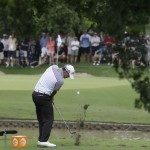 
              Brooks Koepka hits a tee shot on a shortened 14th hole during the second round of the Byron Nelson golf tournament, Friday, May 29, 2015, in Irving, Texas. The 14th fairway was washed over by a flash flood so the the hole was shortened to a 100-yard par 3. (AP Photo/LM Otero)
            